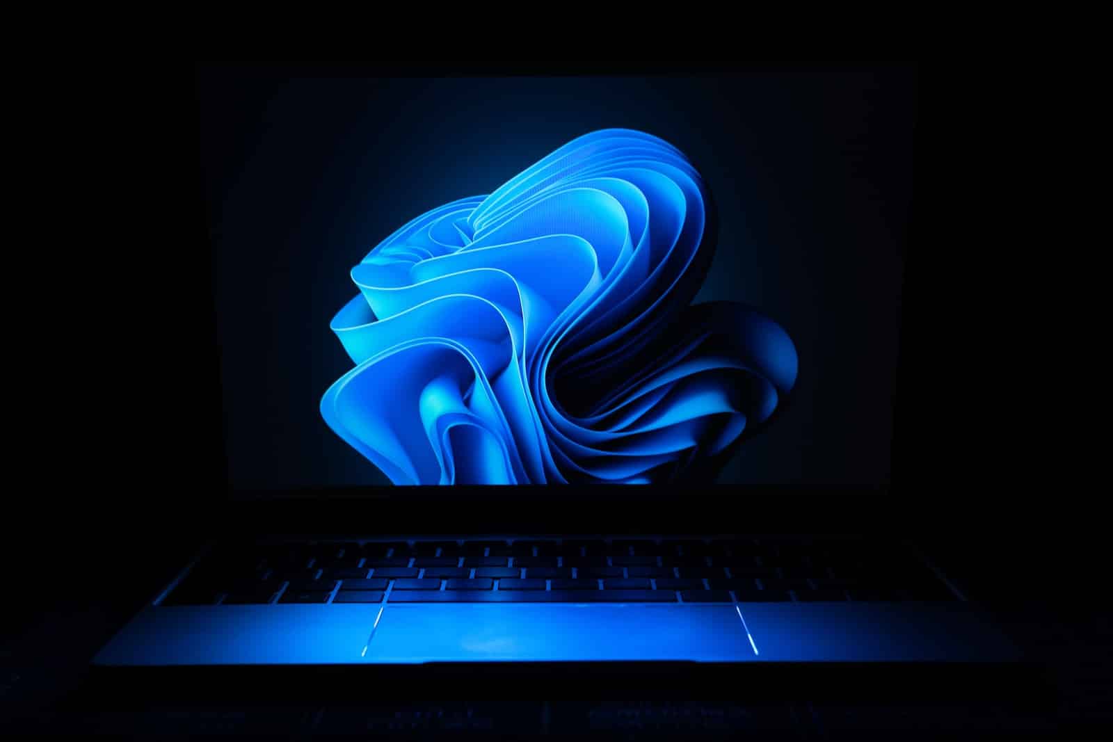 a macbook air laptop in the dark